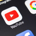 AI’s Secret Alterations Spark YouTube Outrage YouTube and Google app icons on a smartphone screen.