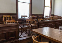 Jury Chaos Erupts: Mangione Trial Stuns Nation Empty jury box and table in courtroom