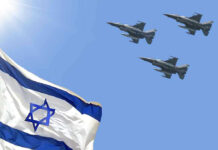 Israeli flag with three fighter jets flying overhead