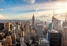 Adams Quits! NYC Mayor Race in Chaos Aerial view of New York City skyline featuring the Empire State Building at sunset