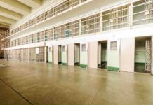 Death Row Monsters Face BRUTAL New Reality Interior view of a prison cell block with empty cells and security bars