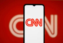 Amanpour’s Shocking Hostage Comparison UNDER FIRE CNN logo on a phone screen