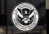 Violent Anarchists Clash with Federal Agents US Department of Homeland Security emblem on wall