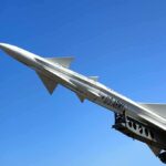 Lockheed’s Missile Breakthrough Stuns Defense World A military missile pointed upwards against a clear blue sky