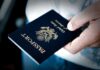 X Gender Markers ELIMINATED— Airlines PANICKING A person holding a United States passport with a dark background