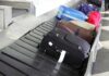 Air Traffic CHAOS Intensifies Various suitcases on an airport luggage carousel