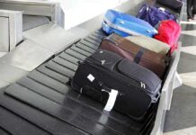 Air Traffic CHAOS Intensifies Various suitcases on an airport luggage carousel