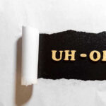 Texas Rep’s Shocking Mistake Ignites Political Firestorm Torn paper revealing UH-OH text underneath.