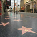 Celebrity EXPOSES Hollywood’s Dark Child Star Secret Hollywood Walk of Fame stars on sidewalk.