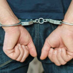 Surveillance Scandal EXPLODES—Police Chief Cuffed Person in handcuffs behind their back.