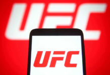 UFC Betting Chaos Exposes Deep Scandal UFC logo on phone screen and background