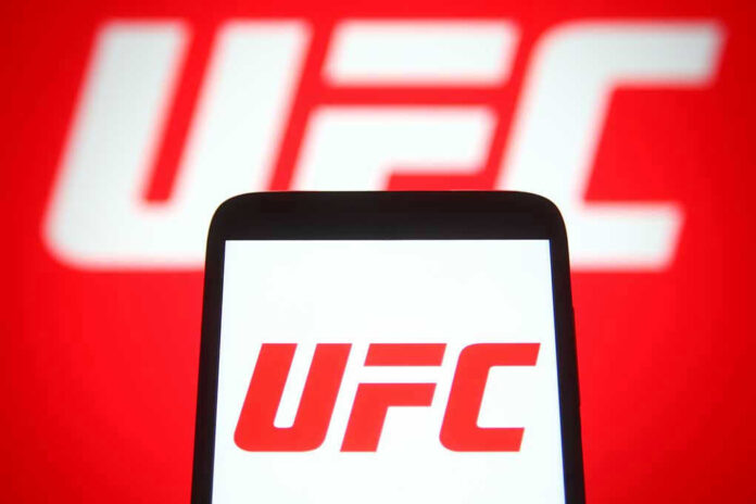 2049779753 UFC logo on phone screen and background