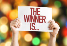 Seattle’s Mayor Shocker — Socialist Takes the Helm Hands holding a sign reading The Winner Is...