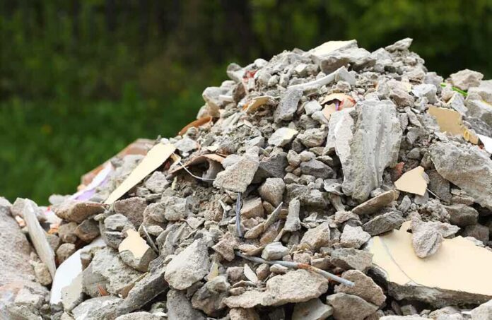 A large pile of construction debris consisting of broken concrete and other materials