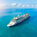 SHOCKING Discovery Under Cruise Ship Bed A large cruise ship sailing on a calm blue ocean