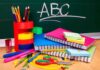 How Chinese Control Our U.S. Schools A collection of colorful school supplies including notebooks, pens, and scissors on a desk