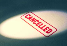 SECRET Airline STATS — Which Airline Will Leave You Stranded? Red Cancelled stamp under a spotlight.