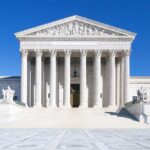 SCOTUS Ruling Supercharges Trump The Supreme Court building featuring marble columns and a clear blue sky