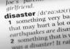 Close-up of a dictionary page showing the definition of the word 'disaster'