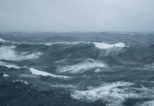 Rough ocean waves under a cloudy sky