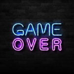 Imprisoned Leader ERUPTS—Declares Regime FINISHED Game Over neon sign on brick wall.