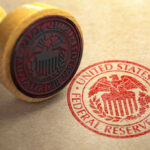 Fed’s Rate MOVE Shocks Wall Street Federal Reserve stamp and wooden stamp on paper