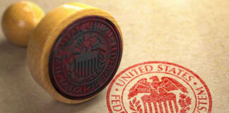 Federal Reserve stamp and wooden stamp on paper