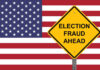 Yellow sign reading Election Fraud Ahead with American flag.