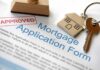 Massive $200 Billion Mortgage Shake-Up! Approved mortgage application form with a house key and keychain