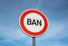 A road sign displaying the word 'BAN' against a blue sky