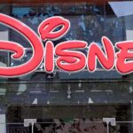 Pipe Bomb Threats SHOCK Disneyland Bright red Disney logo displayed on a storefront window