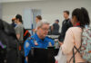 ICE At Airports? Trump Drops Bombshell TSA agent checks passengers documents at airport security.