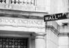Stock Exchange building and Wall Street sign.