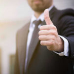 Iran SAYS OK–Look Who Went Through The STRAIT Person in suit giving thumbs up gesture.