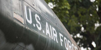 U.S. Air Force plane with trees in background.