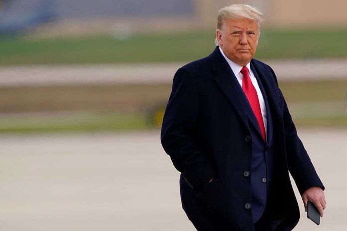 Donald Trump walking outdoors in formal attire