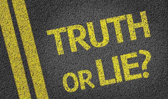 shutterstock_197084936.jpg Yellow text on a black surface asking Truth or Lie