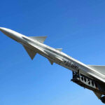 DARK EAGLE READY: Hypersonic ARSENAL UNVEILED U.S. Army missile against a clear blue sky.