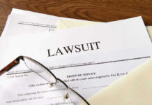 SHOCKING Glock Lawsuit: SO MUCH At Stake Documents labeled Lawsuit with glasses on top.
