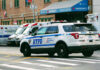 ICE Warning Escalates New York Immigration Fight Police car and ambulances outside emergency room entrance.