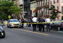 Cartel Crossfire In Mexico Kills American Traveler Police gathered at an urban crime scene.