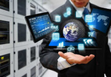 Businessman holding virtual data and analytics hologram.