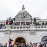 Crowd gathered on steps of Capitol building.
