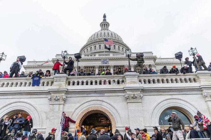 1889190775 Crowd gathered on steps of Capitol building.