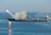 Retaliation Talk Grows After Mysterious Loss Warship firing missile in the sea.
