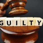 Mass Killer Gets Life as Germany Rejects Terrorism Label A gavel above wooden blocks spelling 'GUILTY'
