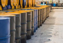 Rows of oil barrels in a storage facility