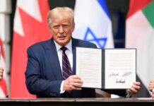 Presidential Interview Ends in Clash A man holding a signed document during a diplomatic event