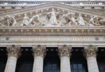 Insider Panic Over Trump’s Trading Blitz Facade of the New York Stock Exchange featuring classical columns and sculptures