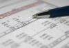 California Wealth Tax Sparks Backlash as Newsom Warns It Could Backfire Close-up of a financial document with highlighted numbers and a pen